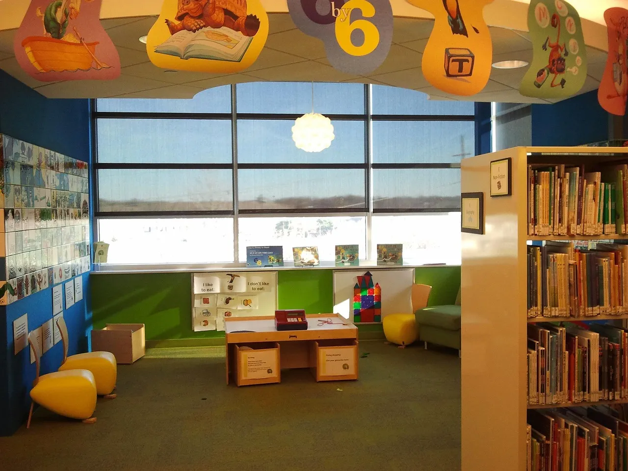 Stock photo related to children's library, reading, children, read for the topic of daycare children playing