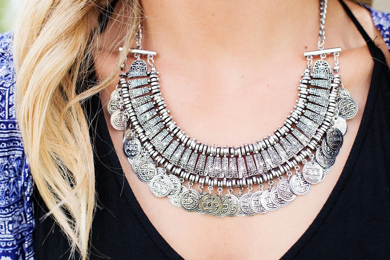 Stock photo related to woman, necklace, jewelry, silver for the topic of person reviewing bank statement
